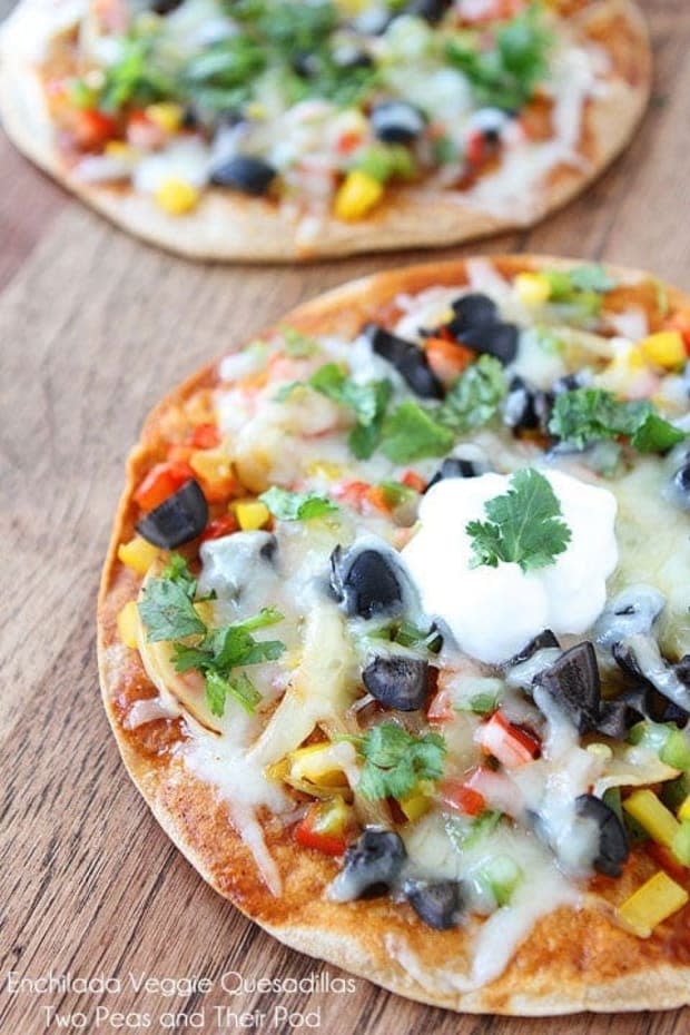 <p>These crisp quesadillas are covered with enchilada sauce, topped with veggies and smothered in cheese. Garnish with fresh cilantro, sour cream (or Greek yogurt) and you have a delicious and healthy meal in minutes.</p><p><strong>Get the recipe: <a href="https://www.twopeasandtheirpod.com/open-faced-enchilada-veggie-quesadillas/" rel="nofollow noopener" target="_blank" data-ylk="slk:Open-Face Enchilada Veggie Quesadillas;elm:context_link;itc:0;sec:content-canvas" class="link "><em>Open-Face Enchilada Veggie Quesadillas</em></a></strong></p><p>Two Peas and Their Pod</p>