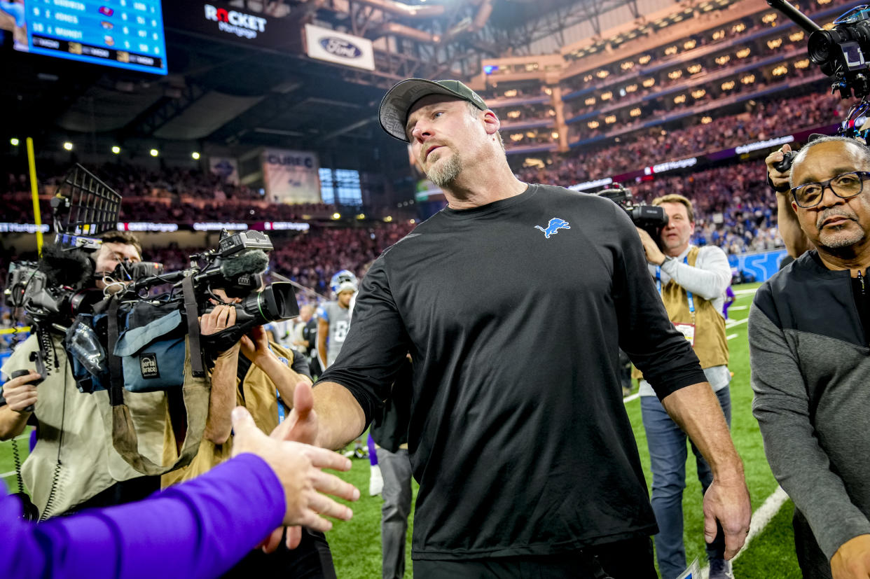 DETROIT, MICHIGAN - JANUARY 07: Head coach Dan Campbell of the Detroit Lions goes to shake hands with head coach Kevin O'Connell of the Minnesota Vikings after the game at Ford Field on January 07, 2024 in Detroit, Michigan. (Photo by Nic Antaya/Getty Images)