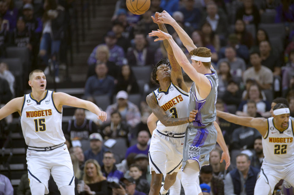 Denver Nuggets guard Bones Hyland (3) guards Sacramento Kings guard Kevin Huerter during the first quarter of an NBA basketball game in Sacramento, Calif., Wednesday, Dec. 28, 2022. (AP Photo/Randall Benton)