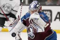 Colorado Avalanche goaltender Darcy Kuemper deflects a shot during the second period of an NHL hockey game against the Los Angeles Kings Thursday, Jan. 20, 2022, in Los Angeles. (AP Photo/Mark J. Terrill)