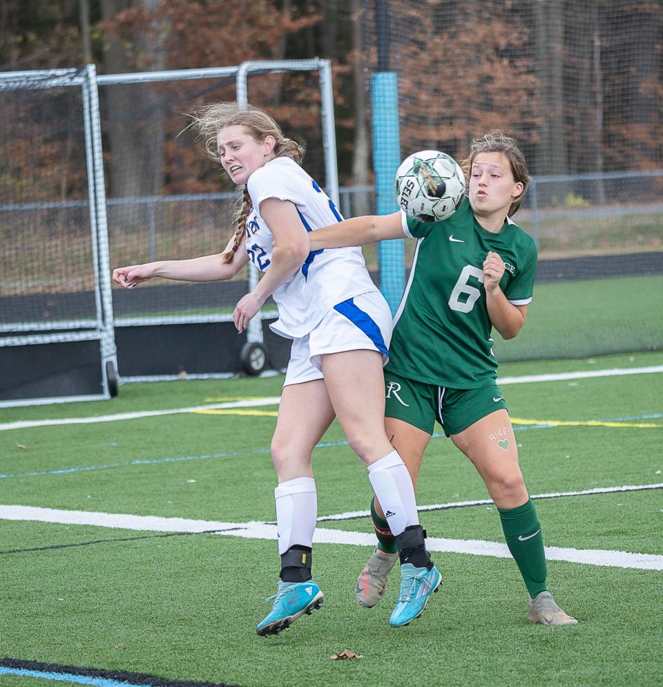 Milton's Cianna Tomasi, left, battles for the ball during the final minutes of the  2022 Division II championship game.