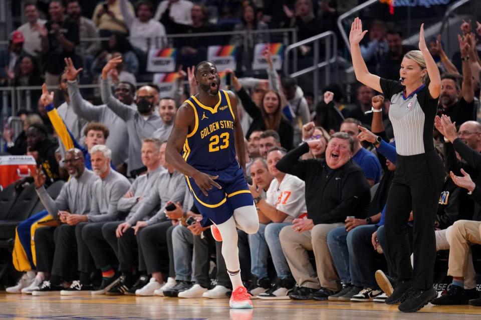 Golden State Warriors forward Draymond Green (23) reacts after making a three point basket against the Sacramento Kings in the first quarter Wednesday, Nov. 1, 2023, at the Chase Center in San Francisco.