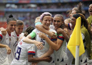 United States' Megan Rapinoe, center, celebrates after scoring the opening goal from the penalty spot during the Women's World Cup final soccer match between US and The Netherlands at the Stade de Lyon in Decines, outside Lyon, France, Sunday, July 7, 2019. (AP Photo/Francisco Seco)