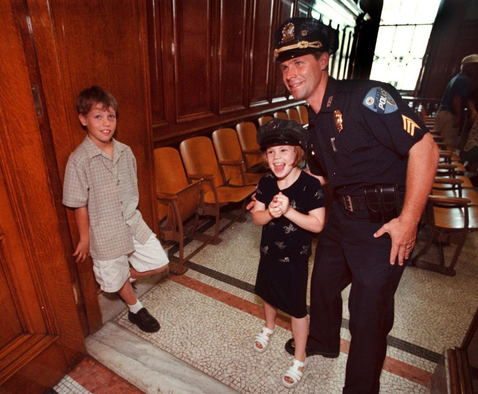 In this photo from June 24, 1999, Steven M. Sargent is shown after his promotion to the rank of lieutenant. He is with his niece Brianna M. Sargent, 6, and, left, his son Steven T. Sargent.