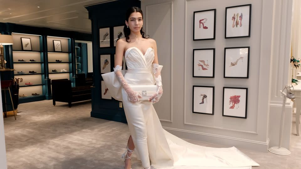 A model showcases a dramatic wedding gown during the presentation of Andrew Kwon's bridal collection in New York City on April 12, 2023. - Rodin Banica/WWD/Getty Images