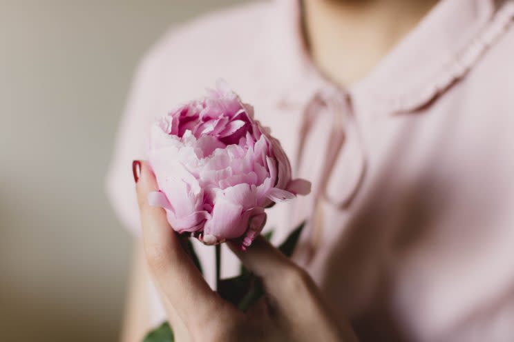 Woman holding flower