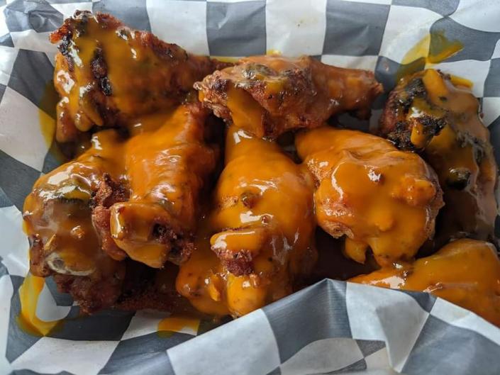 An order of wings tossed in Harry's Smokin' BBQ's mustard and vinegar-based Carolina Gold sauce.