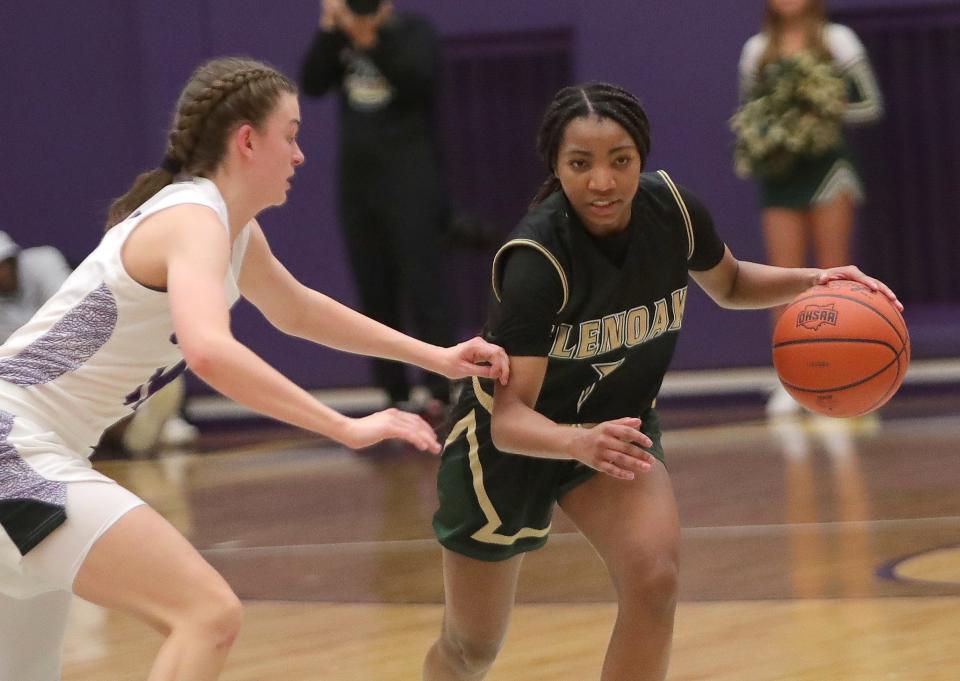 GlenOak's Chandler Vaughn handles the basketball against Jackson's Madison Lepley, Friday, Dec. 22, 2023.