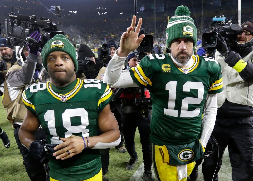 Green Bay Packers wide receiver Randall Cobb (18) and quarterback Aaron Rodgers (12) leave the field together after losing to the Detroit Lions at Lambeau Field. (Dan Powers, Appleton Post-Crescent via USA TODAY)