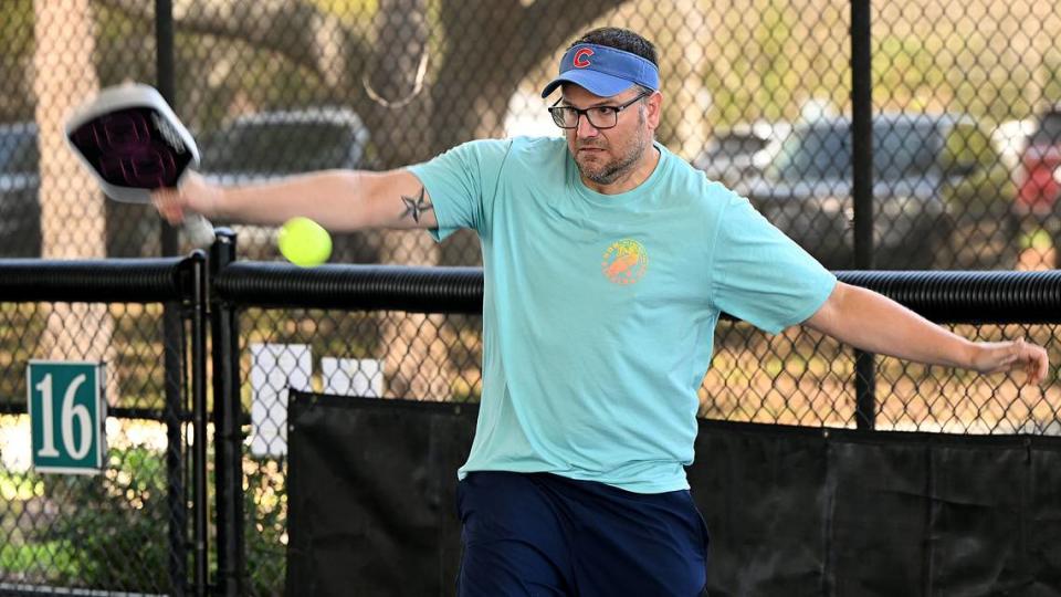 Brandon Burr plays doubles at the C.V. Walton Racquet Center Pickleball Courts at the G.T. Bray Recreation Center.