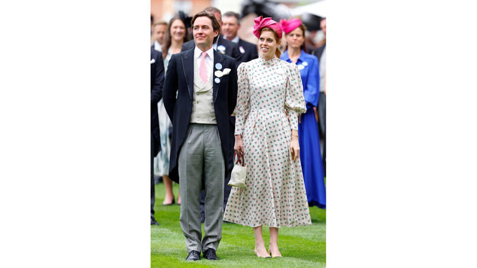 Princess Beatrice wearing a ditsy floral puff sleeve dress with a bright pink hat