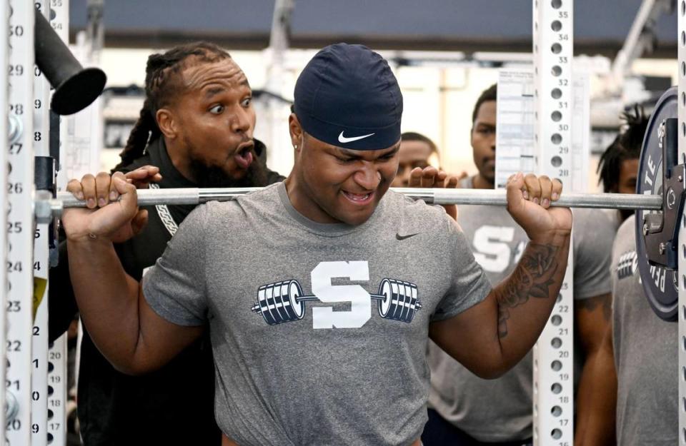 Penn State defensive tackle Xavier Gilliam is cheered on as he lifts during a winter workout session on Thursday, Feb. 29, 2024. Abby Drey/adrey@centredaily.com