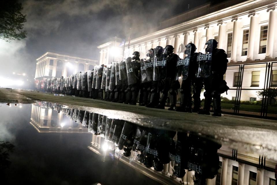 Riot police line up amid angry protests over the shooting of Jacob Blake in Kenosha (REUTERS)