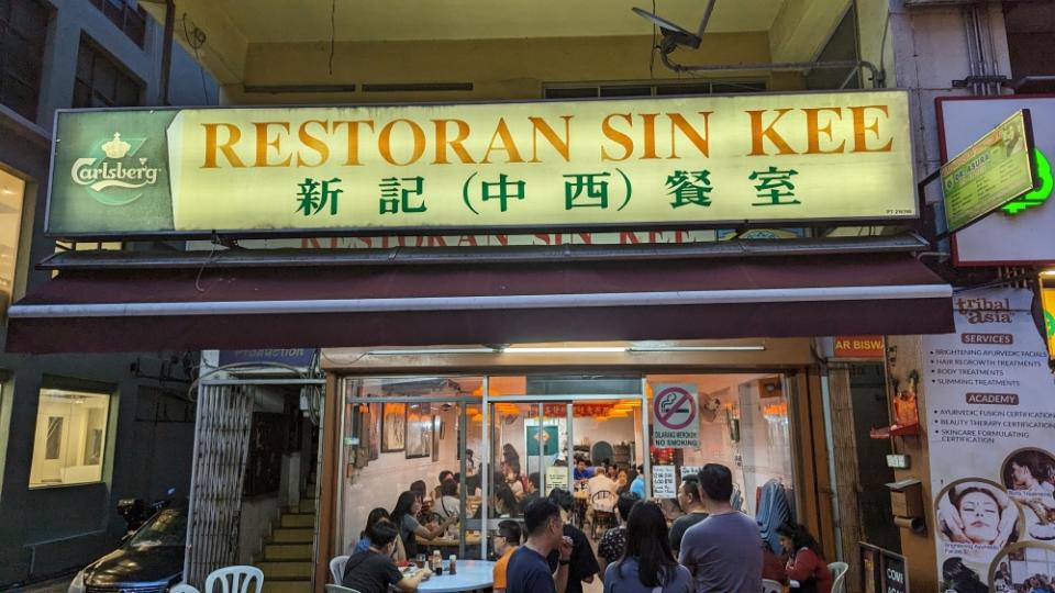 The enduring sign of Sin Kee on Jalan Tun Sambanthan, amidst a bevy of Indian restaurants.