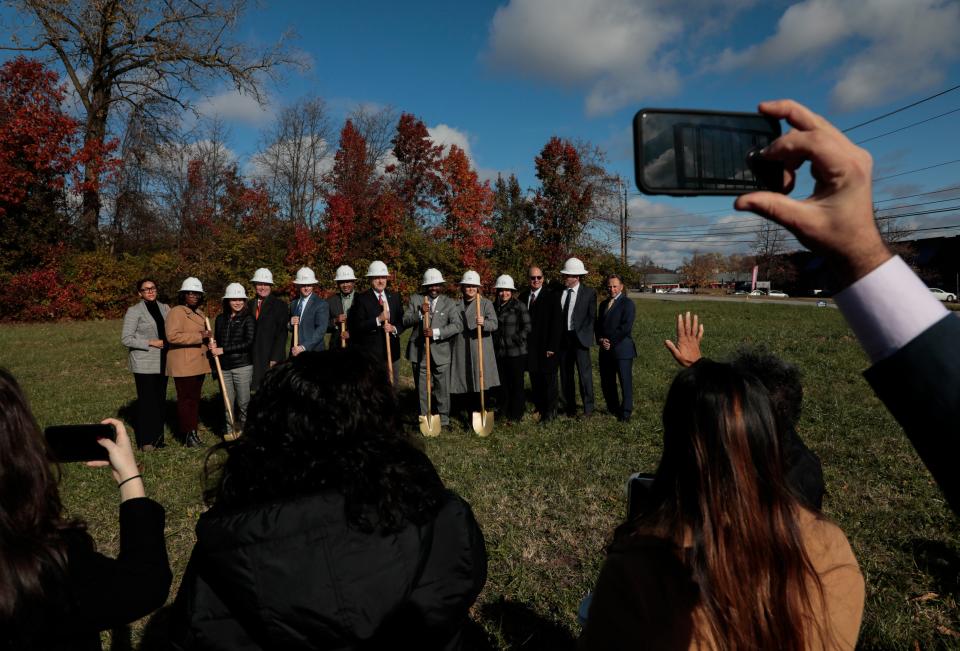 Nov. 15, 2021; Columbus, Ohio, USA; Dignitaries stand on the site of the new $45 million Sinclair Apartments during a groundbreaking ceremony to celebrate the start of construction. This three-building, four-story 180-unit development will bring desperately needed, high-quality affordable housing opportunities to the City of Columbus. Mandatory Credit: Joshua A. Bickel/Columbus Dispatch via USA TODAY Network.