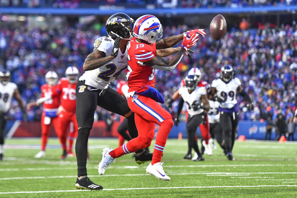 Baltimore Ravens cornerback Marcus Peters (24) breaks up a pass intended for Buffalo Bills wide receiver John Brown (15) during the second half of an NFL football game in Orchard Park, N.Y., Sunday, Dec. 8, 2019. The Ravens won 24-17. (AP Photo/Adrian Kraus)