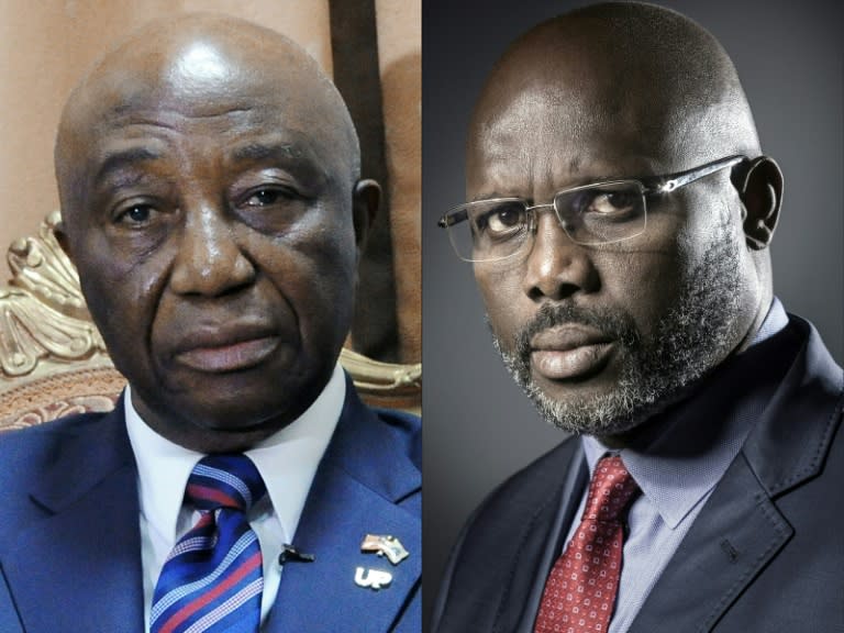 Sirleaf's vice-president Joseph Boakai (L) lost out to former football star George Weah in the December 26 poll