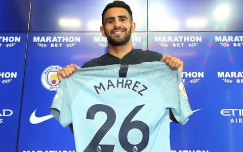 Manchester City's Riyad Mahrez is unveiled at Manchester City Football Academy - Credit: Getty Images