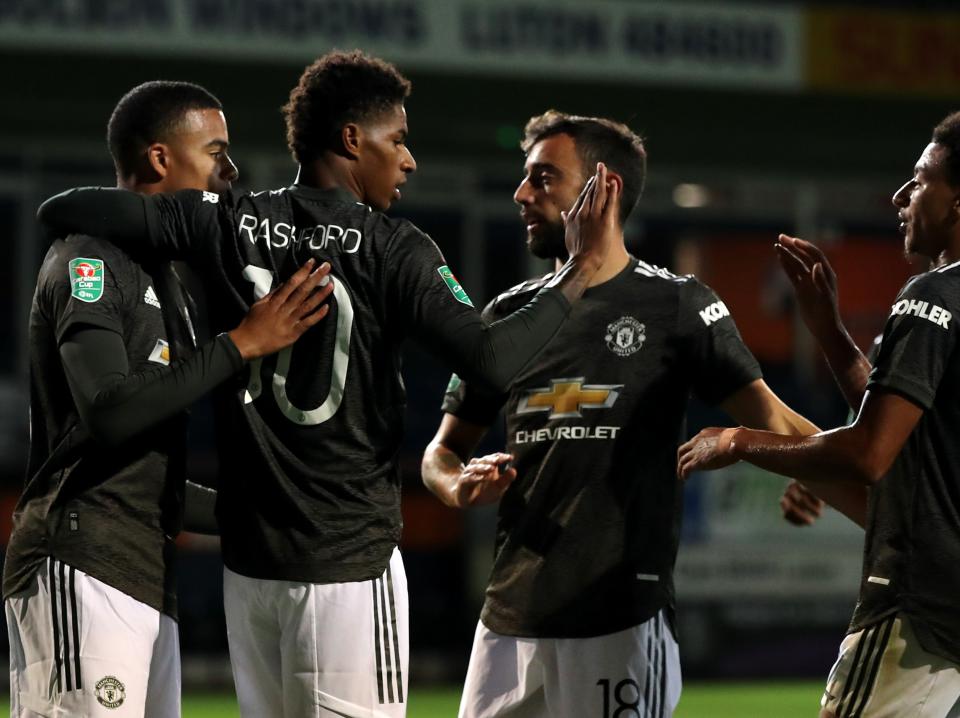 Marcus Rashford celebrates his late goal at Kenilworth Road (Getty Images)