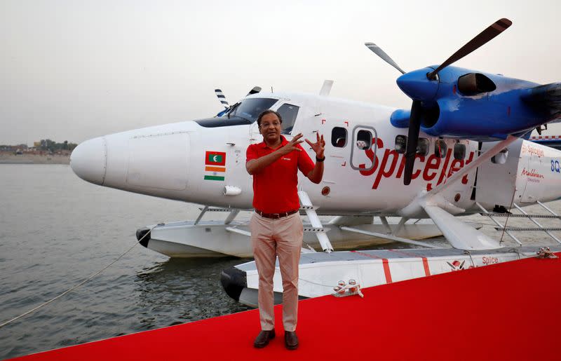 FILE PHOTO: Ajay Singh speaks with the media next to a seaplane in Ahmedabad