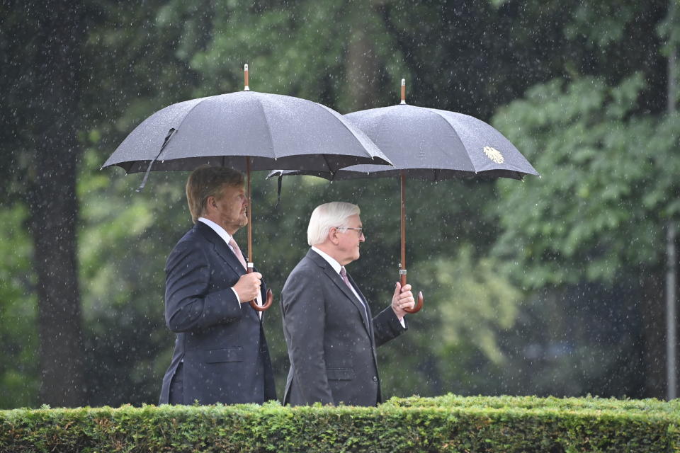 German president Frank-Walter Steinmeier, right, welcomes King Willem-Alexander of the Netherlands at the Bellevue palace ion Berlin, Germany, Monday, July 5, 2021. The Royals arrived in Germany for a three-day visit that was delayed from last year because of the coronavirus pandemic. (Bernd Von Jutrczenka/dpa via AP)