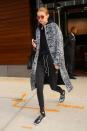 <p>These sweats look runway ready thanks to Gigi's reflective shades and fashion-y coat. </p>