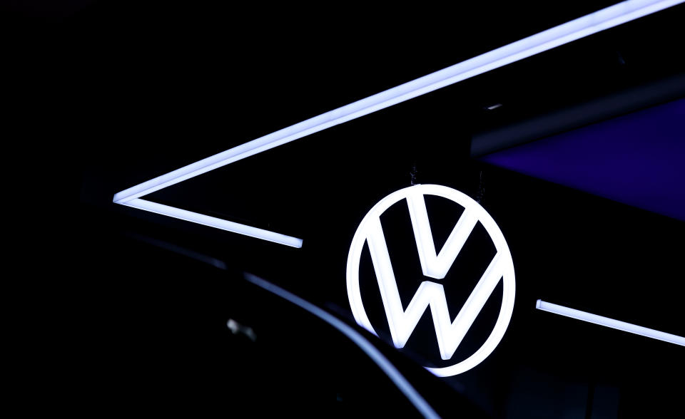 The VW Logo is reflected in a new Volkswagen (VW) ID.3 electric automobile at the headquarters of German car maker Volkswagen in Wolfsburg on October 26, 2020. (Photo by Ronny Hartmann / AFP) (Photo by RONNY HARTMANN/AFP via Getty Images)