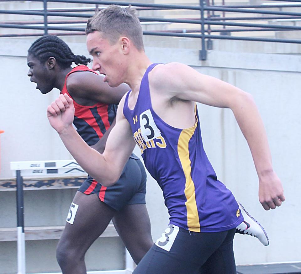 Watertown's Jerome Zebroski (front) battles Christ Bwangoy-Bankaza of Brookings in the boys' 300-meter hurdles during the Mark Wendelgass Relays track and field meet on Friday, May 19, 2023 in Mitchell. Zebroski took second and Bwangoy-Bankaza third in the event.