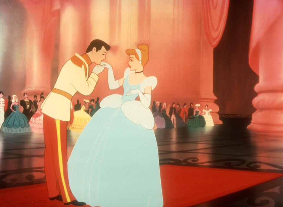 The prince kissing Cinderella's hand at the ball