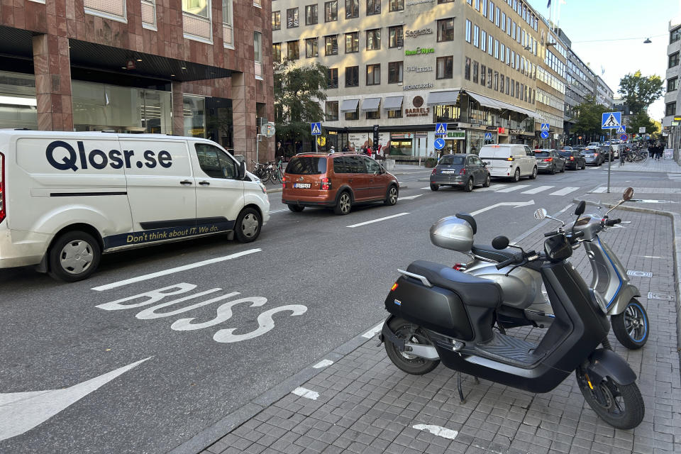 Cars drive on a road in the city center in Stockholm, Sweden, Thursday, Oct. 12, 2023.The Swedish capital plans to ban petrol and diesel cars from parts of Stockholm, gradually starting with a little-congested downtown commercial district, in an effort to curb pollution and reduce noise but also to push the technical progress toward more electric vehicles. (AP Photo/Karl Ritter)