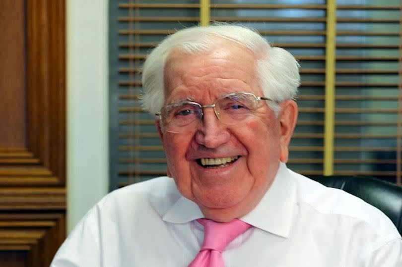 Sir Jack Petchey smiling for his photo