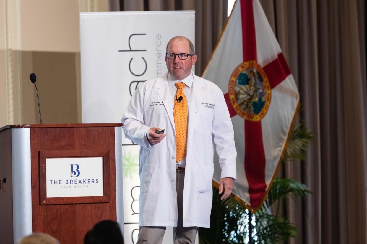Dr. Christopher McCann, a board-certified gynecologic oncologist, delivers a presentation on robotic surgery to guests Wednesday at the Palm Beach Chamber of Commerce's monthly breakfast meeting at The Breakers.