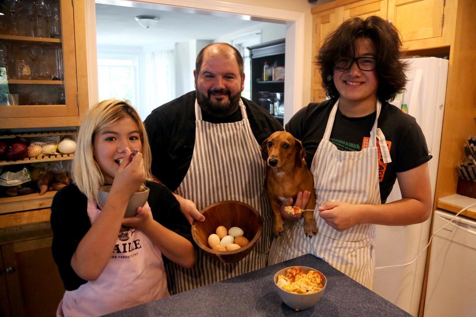 From left, Katrina, Kris and Alex Doane prepare an egg dish for breakfast at their Exeter home on Friday, July 15, 2022. Kris created an online fresh egg finding map for the Seacoast that anyone can access.