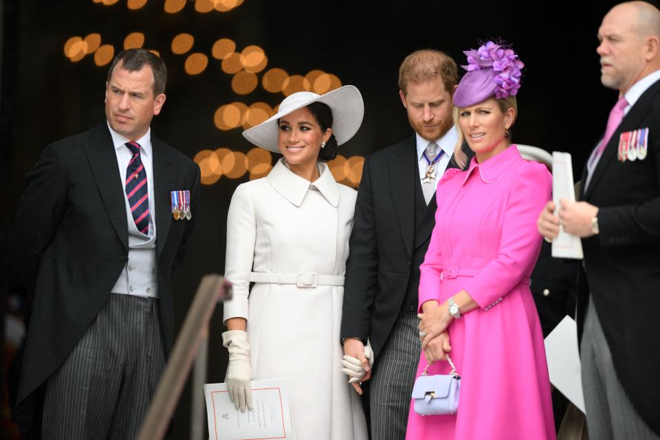 TOPSHOT - (L-R) Peter Phillips, Meghan, Duchess of Sussex, Britain's Prince Harry, Duke of Sussex, Zara Phillips and Mike Tindall leave after attending the National Service of Thanksgiving for The Queen's reign at Saint Paul's Cathedral in London on June 3, 2022 as part of Queen Elizabeth II's platinum jubilee celebrations. - Queen Elizabeth II kicked off the first of four days of celebrations marking her record-breaking 70 years on the throne, to cheering crowds of tens of thousands of people. But the 96-year-old sovereign's appearance at the Platinum Jubilee -- a milestone never previously reached by a British monarch -- took its toll, forcing her to pull out of a planned church service. (Photo by Daniel LEAL / POOL / AFP) (Photo by DANIEL LEAL/POOL/AFP via Getty Images)