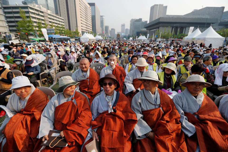 <p>Buddhist monks interact among themselves as they attend a prayer service wishing for a successful inter-Korean summit in Seoul, South Korea, April 27, 2018. (Photo: Jorge Silva/Reuters) </p>