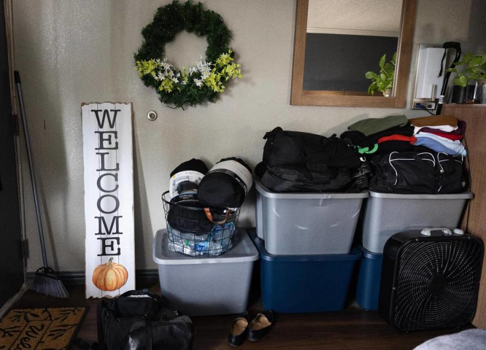 Belongings are stored in Charlotte Smith’s hotel room at White Settlement’s Red Roof Inn on May 4, 2023. Smith and her daughter have struggled to find housing after being evicted.