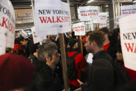 Hundreds of New York Times journalists and other staff protest outside the Times' office after walking off the job for 24 hours, frustrated by contract negotiations that have dragged on for months in the newspaper's biggest labor dispute in more than 40 years, Thursday, Dec. 8, 2022, in New York. (AP Photo/Julia Nikhinson)