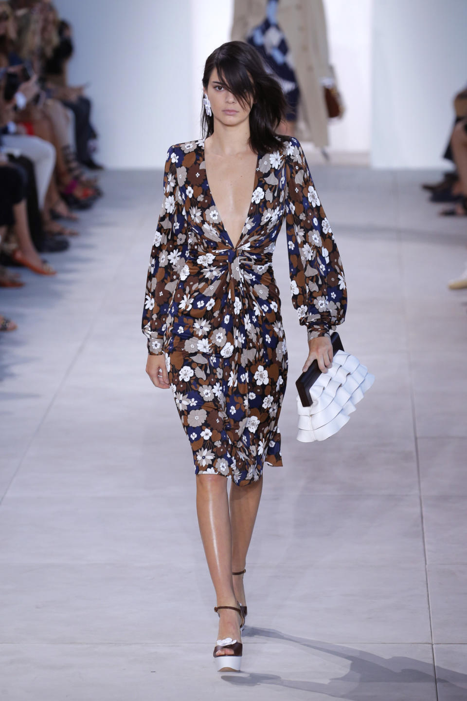 <p>Clad in a plunging floral dress, Kendall stormed the runway at the Michael Kors show.<i> [Photo: Getty]</i></p>