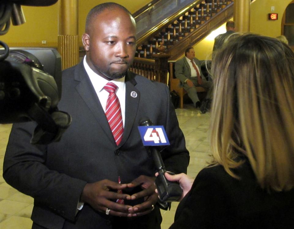 District Attorney Mark Dupree of Wyandotte County, Kansas, answers a television reporter's questions following a Kansas House committee hearing on Tuesday, May 16, 2017, in Topeka, Kansas. (AP Photo/John Hanna)