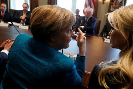 Germany's Chancellor Angela Merkel (L) and Ivanka Trump speak during a roundtable discussion between U.S. President Donald Trump and German and U.S. business leaders on vocational training at the White House in Washington, U.S. March 17, 2017. REUTERS/Jonathan Ernst