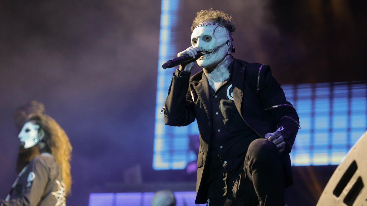  Corey Taylor singing on stage. 