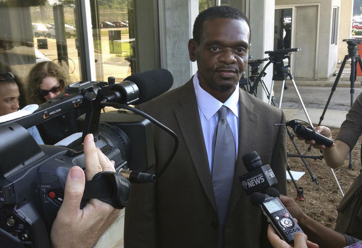 In this Sept. 3, 2014 photo, Henry McCollum walks out of prison after being released from Central Prison in Raleigh, N.C. 