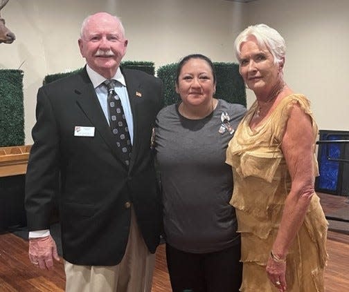 John and Celeste Schleimer pose with Cpl. Hunter Lopez’s mother, Alicia Lopez (center). The Schleimer family made the donation for the Hunter Lopez scholarship.