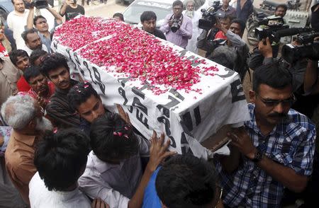 Relatives carry the coffin of Saulat Mirza, who was sentenced to death by an anti-terrorism court in 1999 for killing three people and hanged, after his body arrived in Karachi, Pakistan, in this May 12, 2015 file photo. REUTERS/Athar Hussain/Files