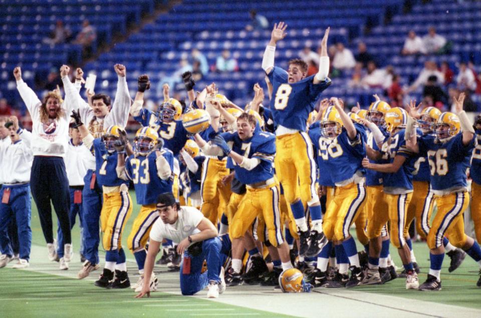 Cathedral football celebrates their 1992 Class B state title Friday, Nov. 27, 1992, at the Metrodome in Minneapolis.