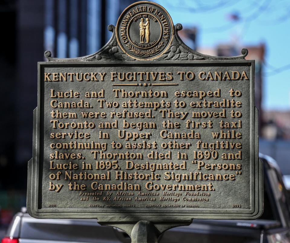 Kentucky Fugitives to Canada plaque at 4th and Main.