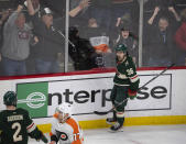 Minnesota Wild right wing Mats Zuccarello (36) celebrates after he lifted the puck over the glove of Philadelphia Flyers goaltender Carter Hart (not shown) for the winning goal in overtime of an NHL hockey game Thursday, Jan. 26, 2023, in St. Paul, Minn. (Jeff Wheeler/Star Tribune via AP)