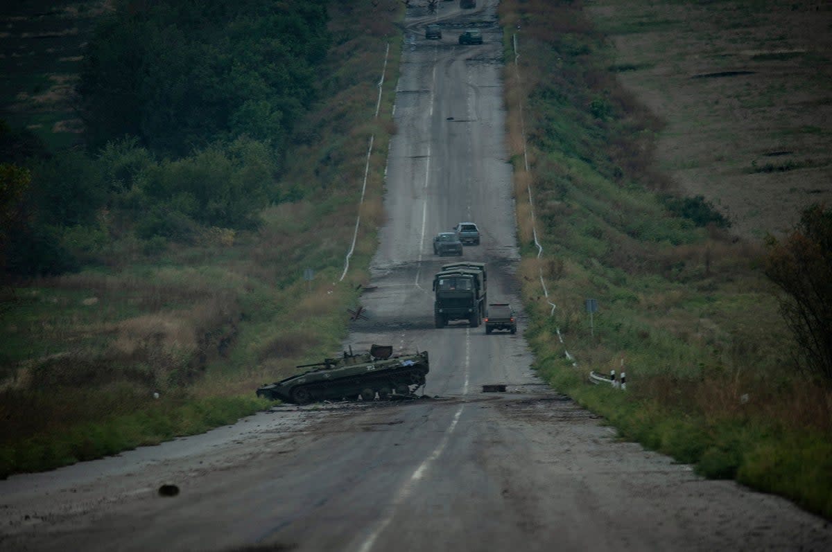 A destroyed vehicle near the town of Izium, which was recently liberated by the Ukrainian army.  (via REUTERS)