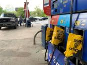 Out of service fuel nozzles are covered in plastic on a gas pump at a gas station in Waynesville, North Carolina, after a gasoline supply crunch caused by the Colonial Pipeline hack