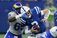 Indianapolis Colts quarterback Carson Wentz (2) is sacked by Los Angeles Rams' Sebastian Joseph-Day during the second half of an NFL football game, Sunday, Sept. 19, 2021, in Indianapolis. (AP Photo/AJ Mast)